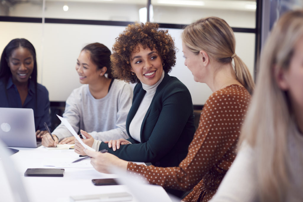 women leaders at conference table