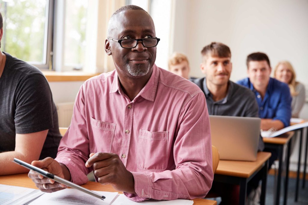 African American senior male in college classroom