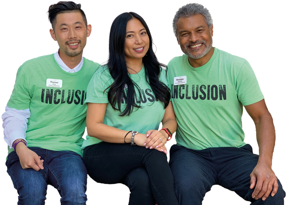 three HumanGood team members wearing "INCLUSION" t-shirts