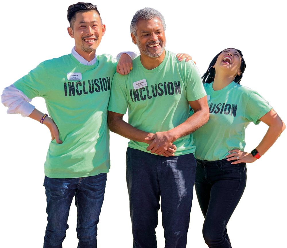 three HumanGood team members wearing "INCLUSION" t-shirts